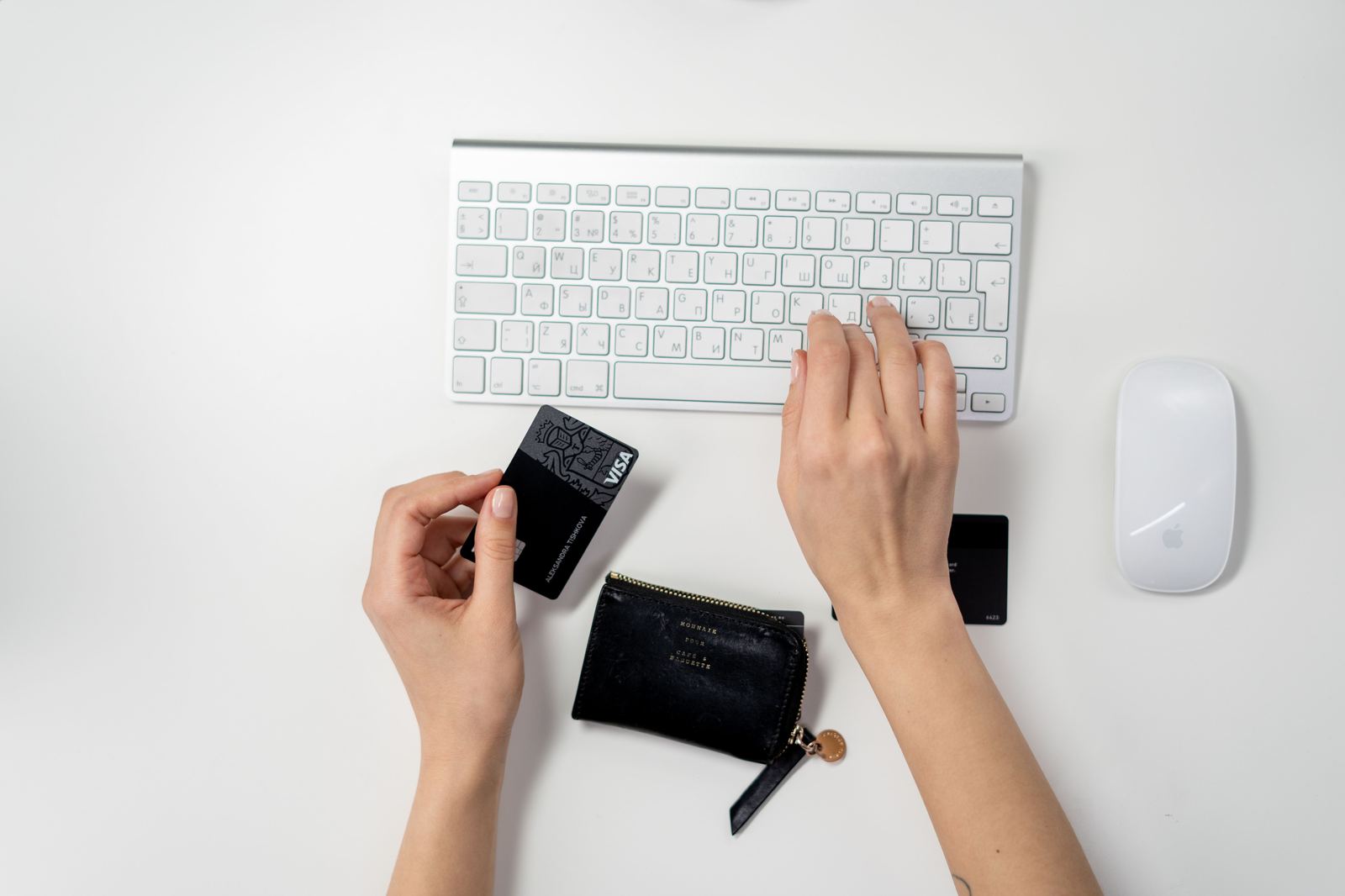 Card, cash and calculator at a seller desk - illustrative