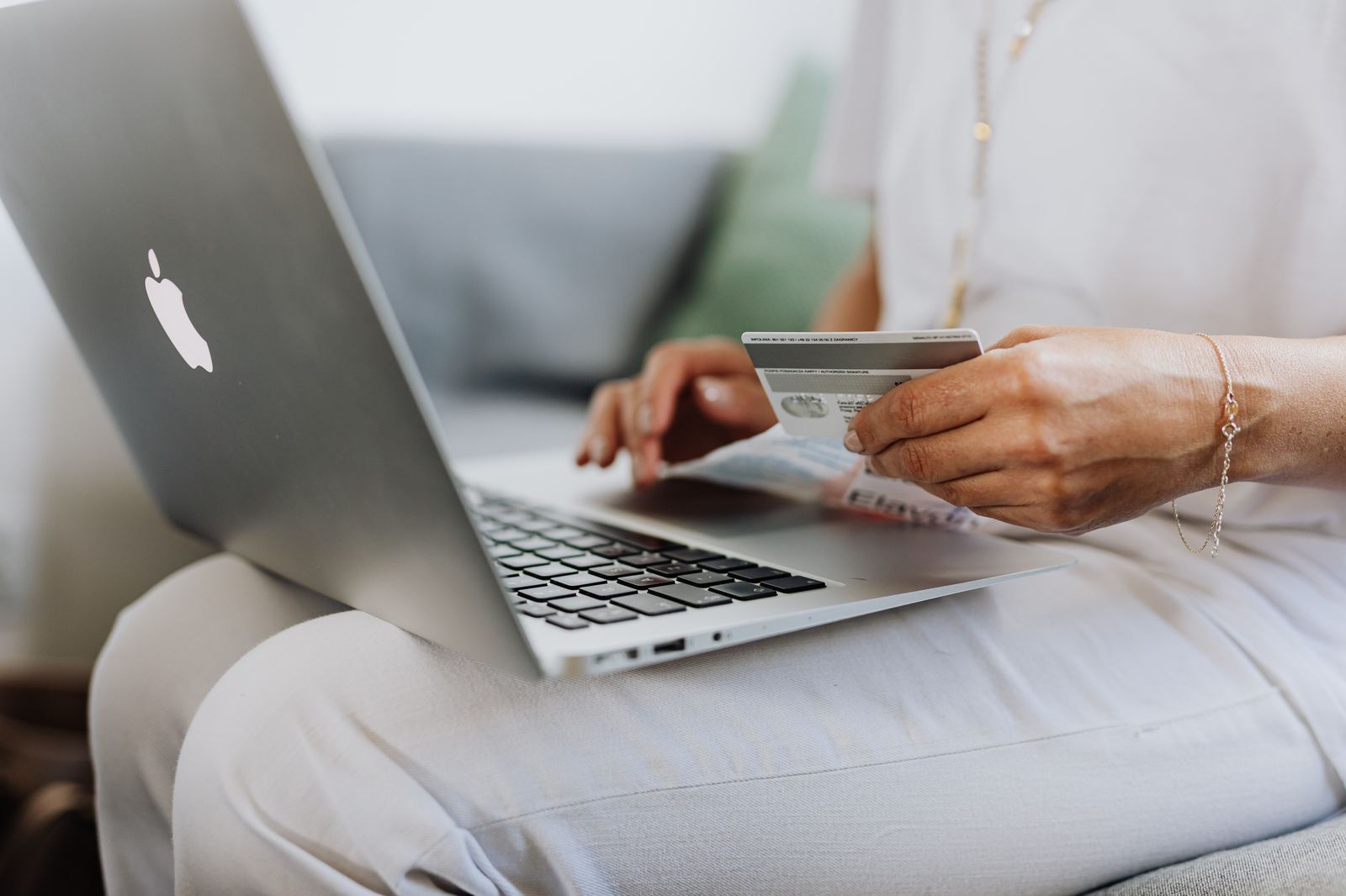 Card, cash and calculator at a seller desk - illustrative