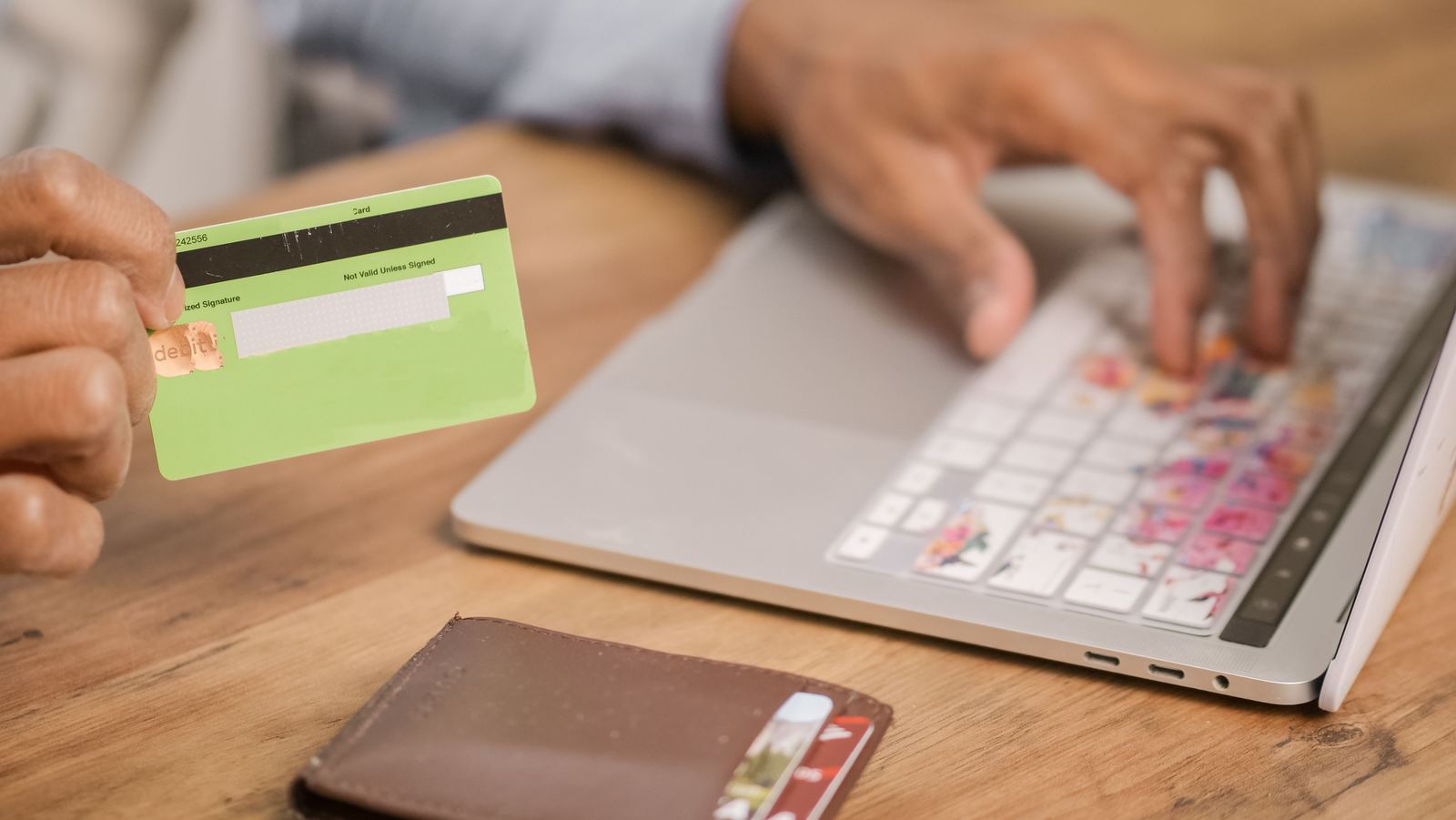 Card, cash and calculator at a seller desk - illustrative
