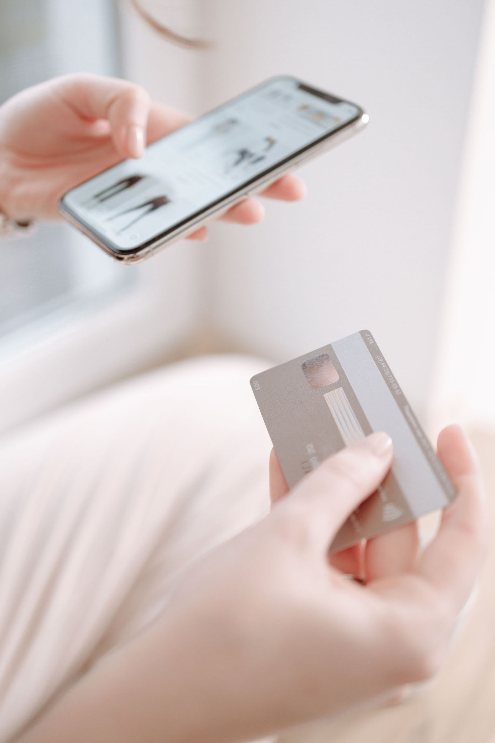 Card, cash and calculator at a seller desk - illustrative